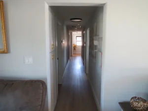 Bright hallway leading to residents' rooms